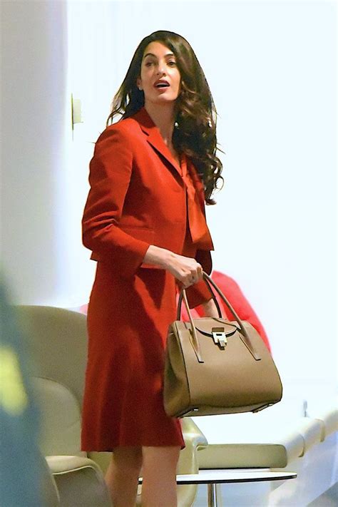 amal clooney handbags|amal clooney bathing suit.